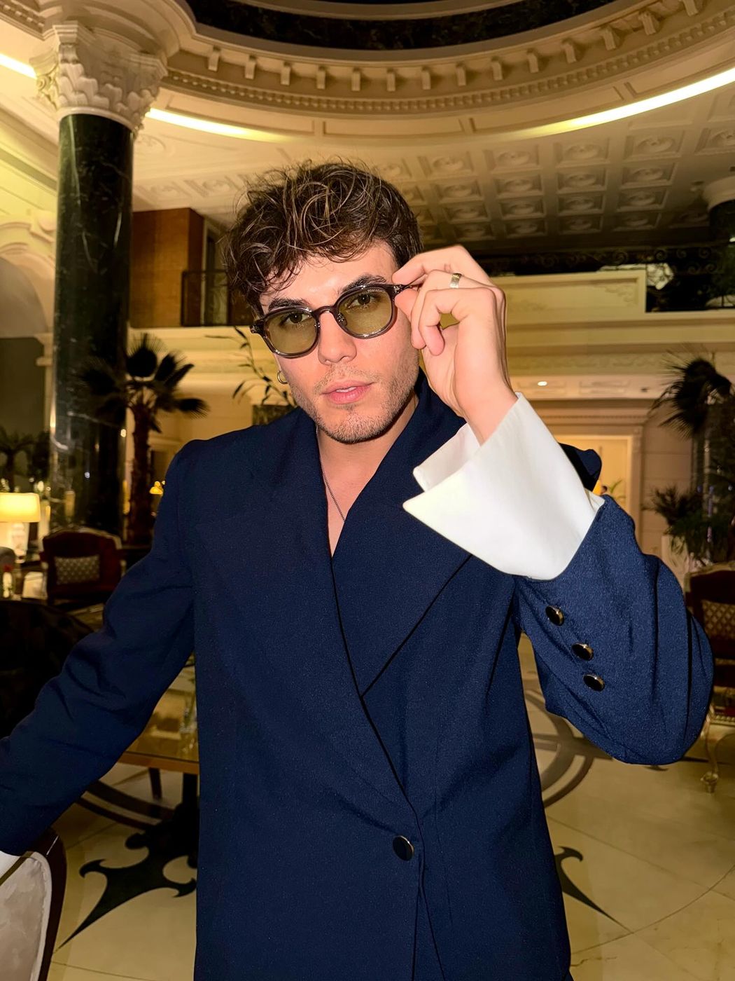 Klodian Mihaj in a navy suit and sunglasses